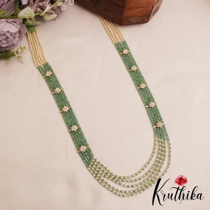 Sparkling Multi Layered crystal & Pearl statement Haaram with floral accents